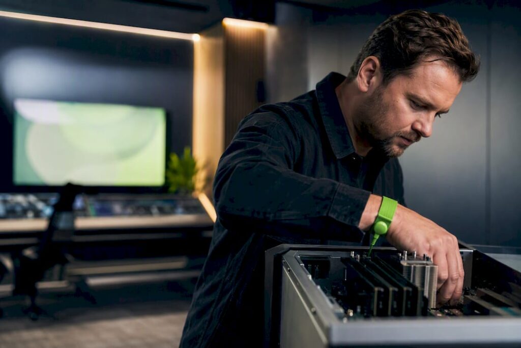 Technician inspects custom-built hardware for broadcast