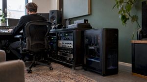 Studio computer next to audio equipment