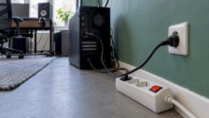 Computer connected to a power strip with a switch
